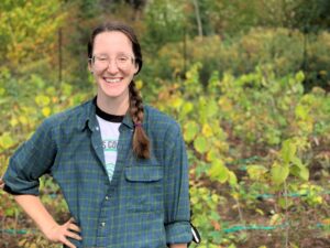 Picture of new Recording Secretary Katie Pita located in a forested environment.